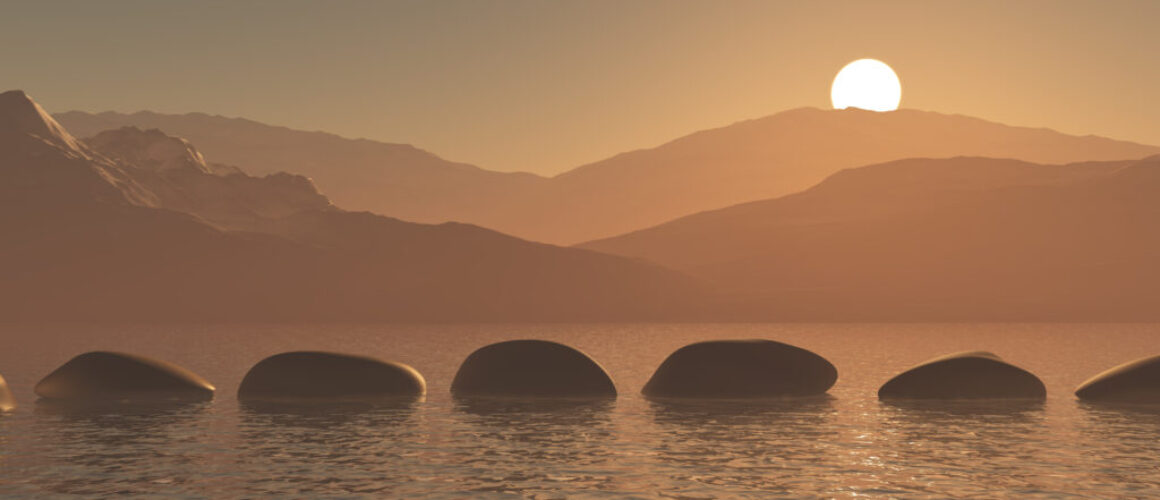 3D stepping stones in the ocean against a sunset mountain landsc